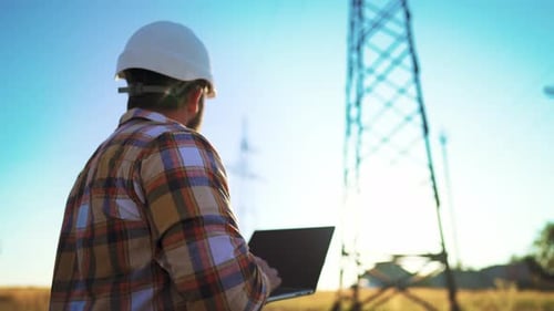 Male Engineer Using Laptop Computer to Online Work in Wheat Field Thinks and Rubs His Beard