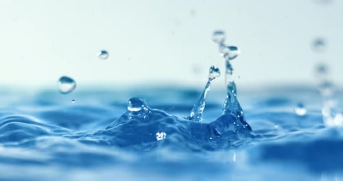 Captivating Water Droplets Colliding in Slow Motion