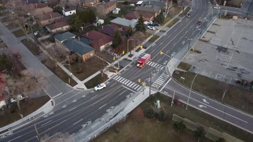 Aerial View Of Fire Engine Truck Responding And Driving In The Road.