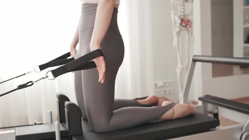 Woman Doing Pilates Exercise at Home