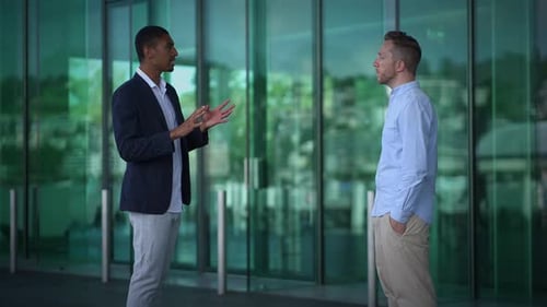 Engaging in a Professional Business Discussion in a Contemporary Office Environment Setting