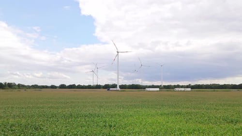 Wind turbines next to highway