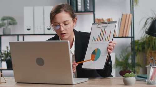 Business Woman Working at Office Talking Online Communication Video Call Shows Graphical Analytics