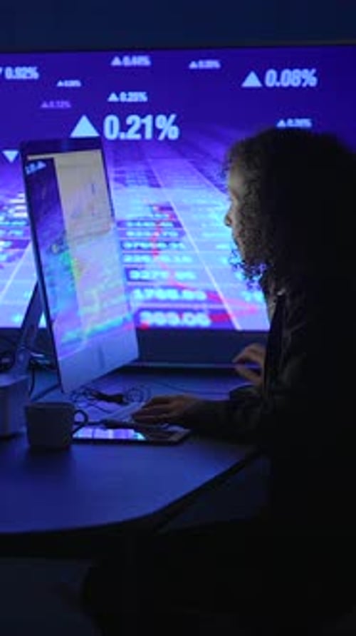 A Focused Trader Analyzing Various Stock Market Data and Trends on His Computer Screen