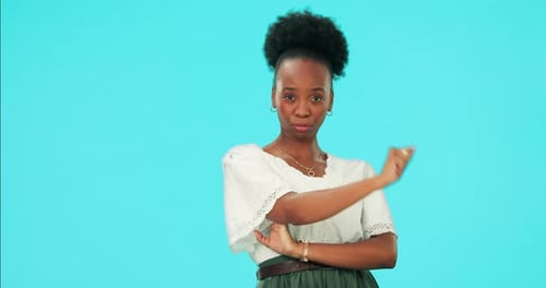 Attitude, face and a black woman with a gesture on a blue background with sassy expression