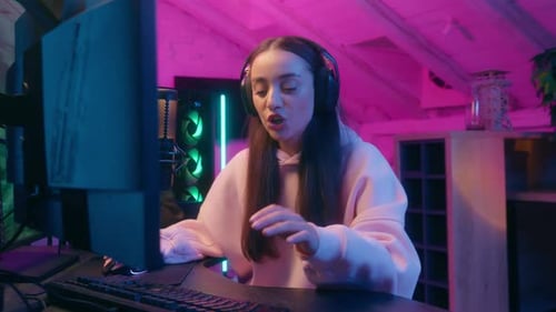 Young Woman Gaming at Home at Night