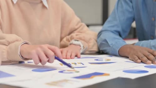 Close up of Business People Working on Documents