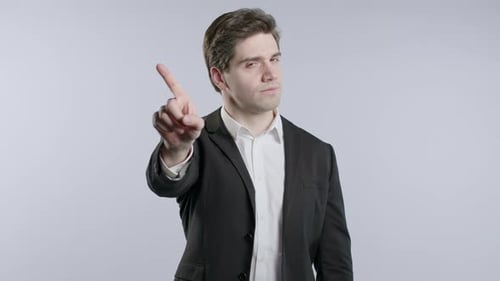 Man in Suit Raises Finger in Rejection