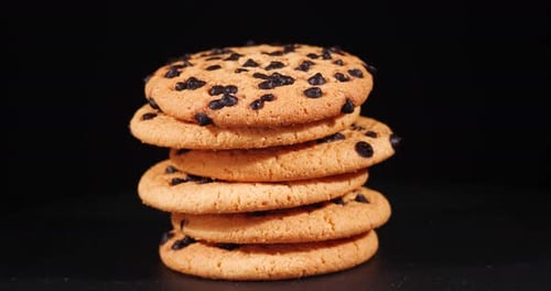 Stack of Cookies with Pieces of Dark Chocolate, Rotation. Homemade Piece Biscuit Side View Rotating