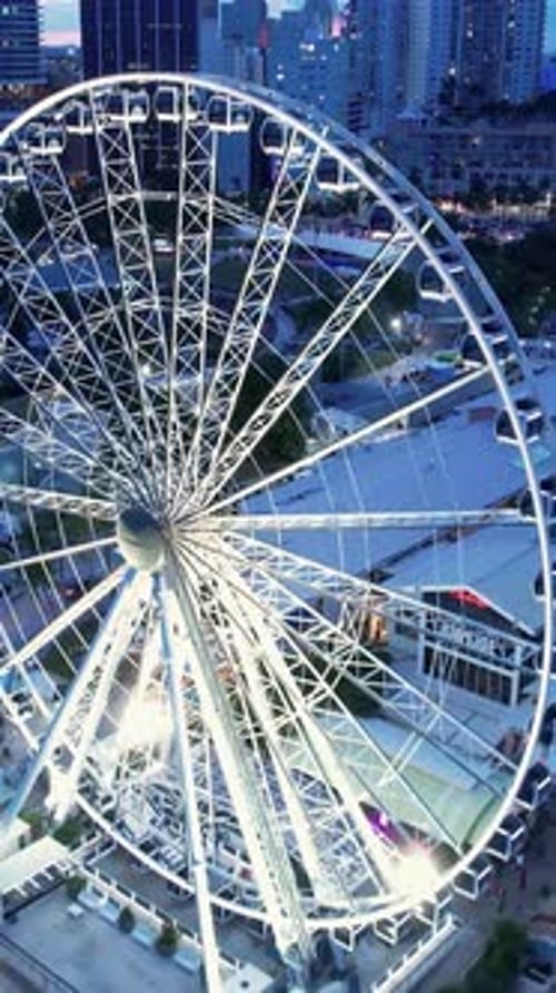 Scenic Ferris Wheel in Sunset Skyline at Miami Florida United States.