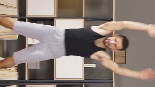 Vertical video of Athlete, fitness man exercising, jumping.