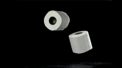 Toilet Paper Falls on the Table On a Black Background Filmed on a Highspeed Camera at 1000 Fps
