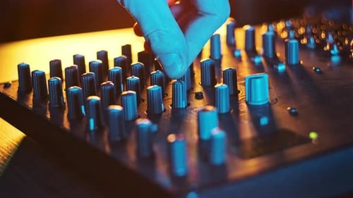 Adjust Volume Controls on the Audio Mixer in Neon Light CloseUp