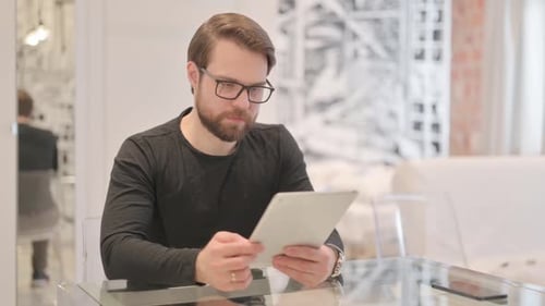 Man with Tablet in Modern Home Interior