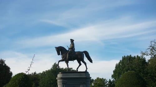 George Washington statue stands tall in Boston public gardens on a summer day