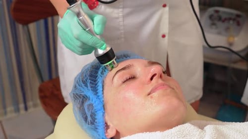 Woman Receiving Facial Treatment at Medical Spa
