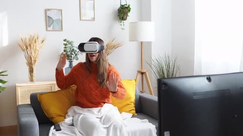 Woman Enjoys Immersive VR Experience at Home