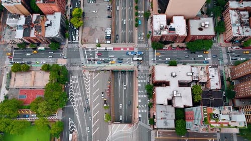 Numerous cars move by the highways and crossroads of modern lively city.