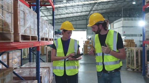 Both of employees in an auto parts warehouse