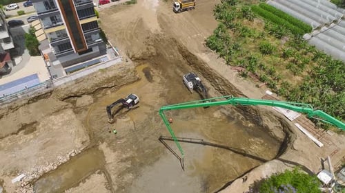 Aerial View Starting Foundations First Concrete Pour and Heavy Machinery