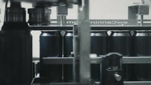 Cans Moving on Conveyor Belt in Factory