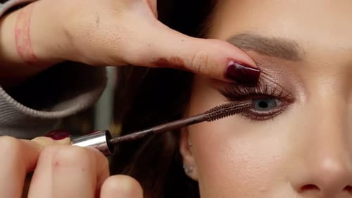 Applying Mascara to Eyelashes in Close Up