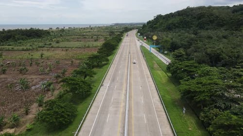 Aerial view of rice field and country road in Java Island, Indonesia.