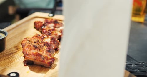 Spring Barbecue Grilled Ribs on a Wooden Desk Barbecue in Nature