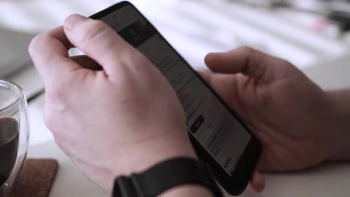 Man scrolling social media in smartphone