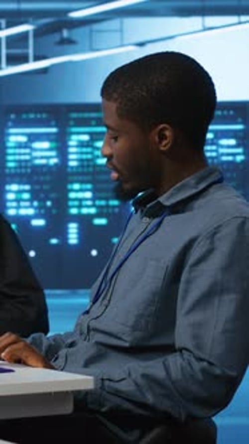 Man and Woman Working in Data Center