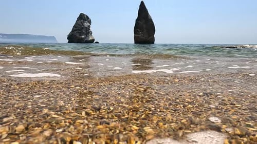 Small Sea Wave Blurred Soft Foamy Waves Washing Golden Sandy Beach and Volcanic Rocky Shores Nobody