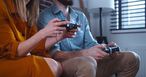 Couple Playing Video Games at Home Together