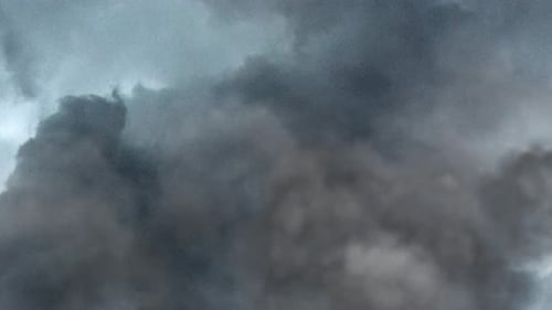 Dark Clouds Billowing Slowly Across the Sky