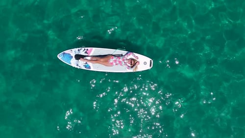 Aerial View Summer Paddleboard Festival in a Bay with People Relaxing