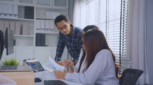 Group of Asian businessman and businesswoman working in the office.