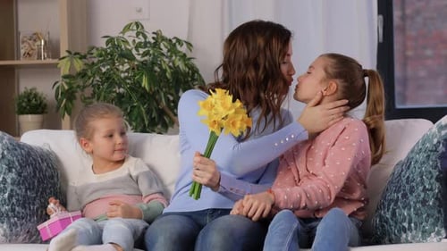 Mother and Daughters with Flowers and Gift