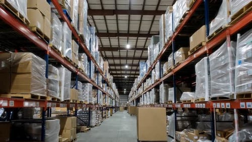 The Interior of a Warehouse is Efficiently Organized with Stocked Shelves and Items