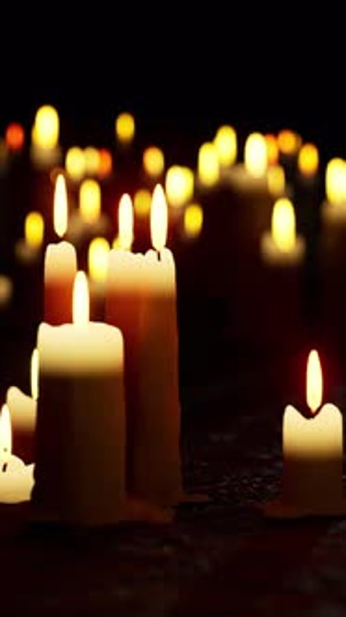Warm Flickering Candles in Dark Ambiance