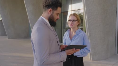 A Business Discussion Taking Place Between Two Highly Skilled Professionals Engaged in Dialogue