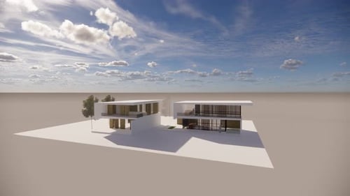 Modernos edificios blancos bajo un cielo azul con nubes