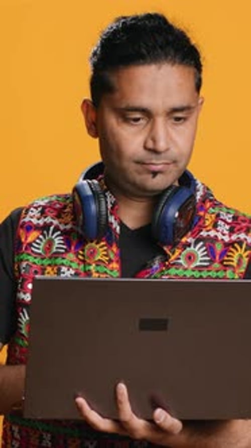 Vertical Video Man Typing on Laptop Frustrated with Malfunctioning Keyboard