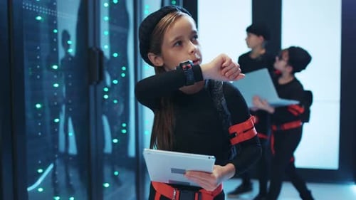 Children Hacking Computers in Futuristic Server Room