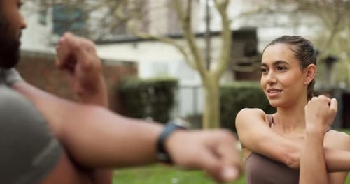 Friends, running and arm stretching for fitness warm up with friendly conversation in urban city