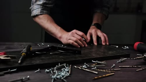 Carpenter Marking Particle Planks In Workshop