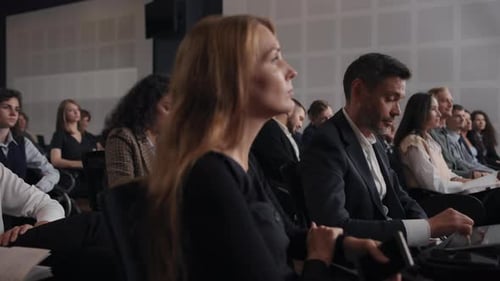 Group of People Listens Speech at Business Conference. Stage Talk at Summit