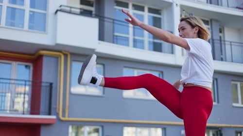 Woman Exercising Outside in Urban Environment