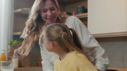 Loving Mother Embracing Her Young Daughter