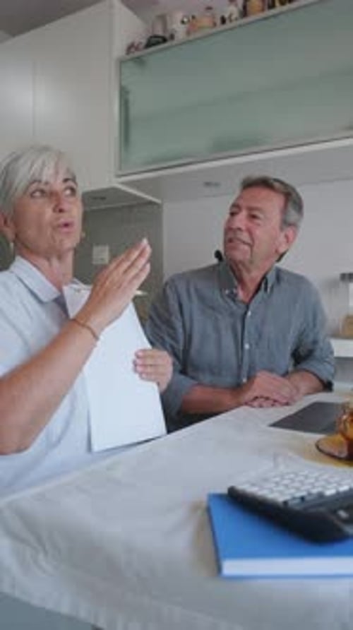 Couple Discussing Finances at Home