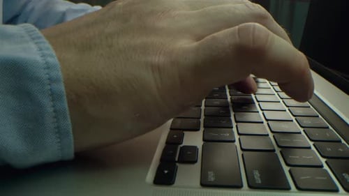 Alternative Macro Close Up of an Young Businessman Hands Busy Working on Laptop or Computer Keyboard