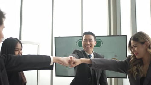 White collar workers are working with team at office.